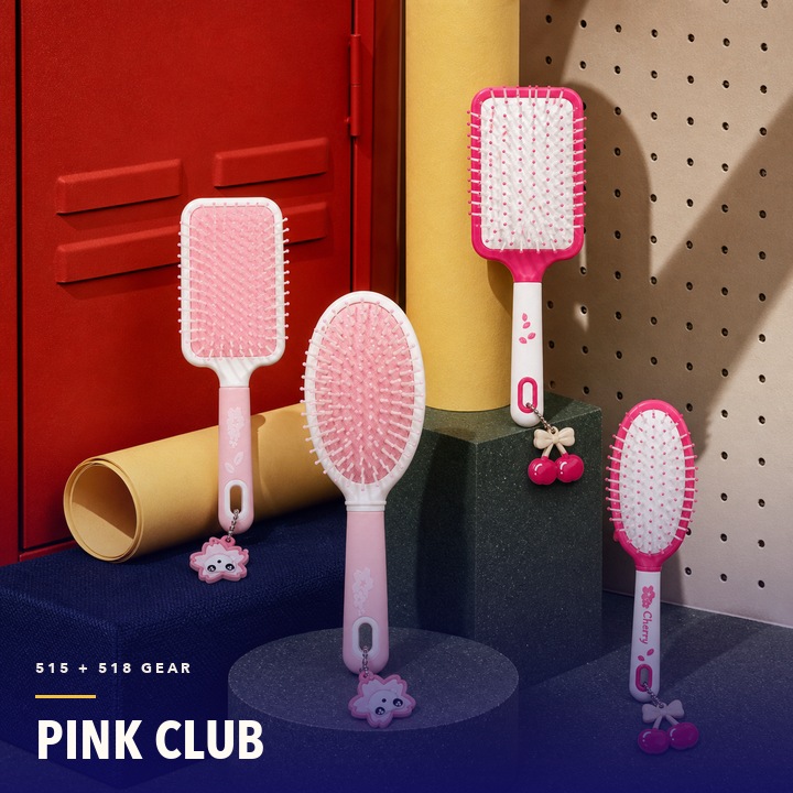 Pink Multica brushes arranged in a playful club set
